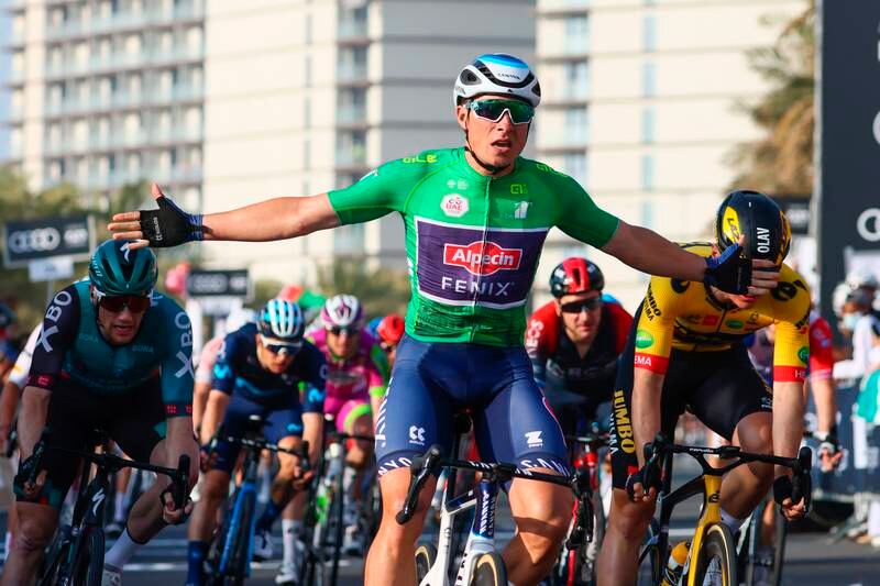 Belgium's Jasper Philipsen of Alpecin-Fenix celebrates as he wins Stage Five of the UAE Tour, from Ras Al Khaimah Corniche to Al Marjan Island, on Thursday, February 24, 2022. AP