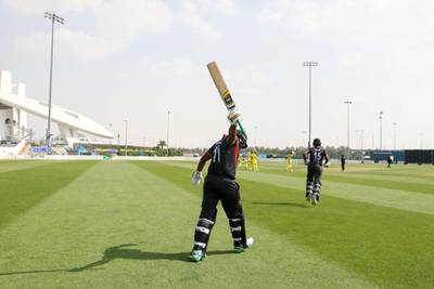 Abu Dhabi, United Arab Emirates - October 22, 2018: Ashfaq Ahmed of the UAE comes out to bat in the match between the UAE and Australia in a T20 international. Monday, October 22nd, 2018 at Zayed cricket stadium oval, Abu Dhabi. Chris Whiteoak / The National