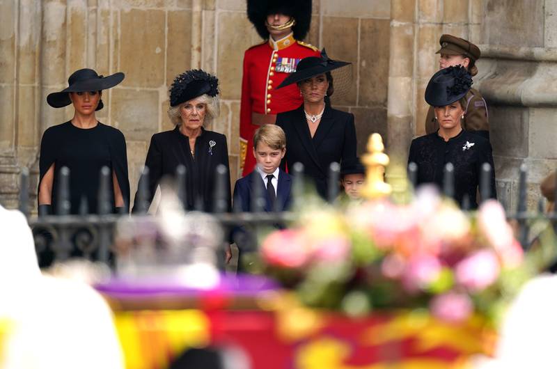 Meghan, Duchess of Sussex; Camilla, the Queen Consort; Prince George; Catherine, Princess of Wales; Princess Charlotte and Sophie, Countess of Wessex, leave the state funeral of Queen Elizabeth II. PA
