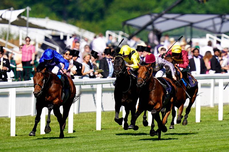 Coroebus, left, ridden by William Buick on their way to victory in The St James's Palace Stakes at Royal Ascot. PA