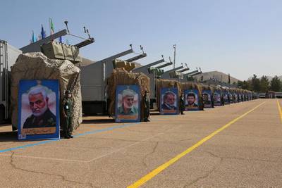Military equipment on display at the Islamic Revolutionary Guard Corps' new missile city in Iran. In the foreground is a portrait of Maj Gen Qassem Suleimani, commander of the IRGC's Quds Force, who was killed in a US drone strike in 2020. EPA