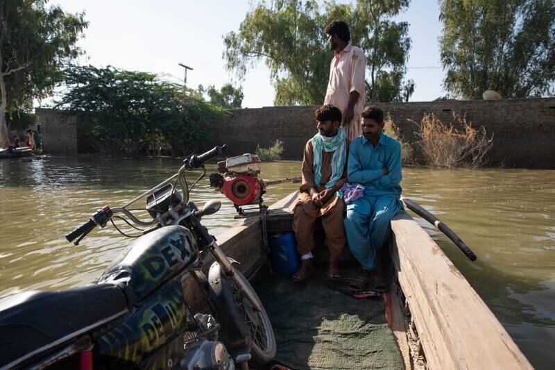 People take boats to cross floodwaters to reach Johi, in Dadu, Pakistan. Nearly one third of Pakistan has been severely affected by flooding this year. Getty Images