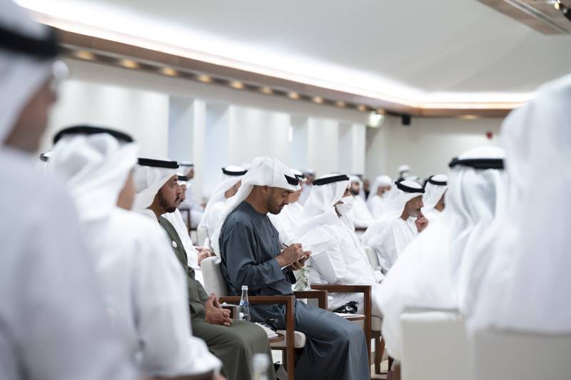 Sheikh Mohamed bin Zayed, Crown Prince of Abu Dhabi and Deputy Supreme Commander of the Armed Forces, takes notes during the lecture. Pictured with Sheikh Mohamed is Sheikh Hamdan bin Zayed, Ruler’s Representative in Al Dhafra Region. Abdulla Al Neyadi / Ministry of Presidential Affairs