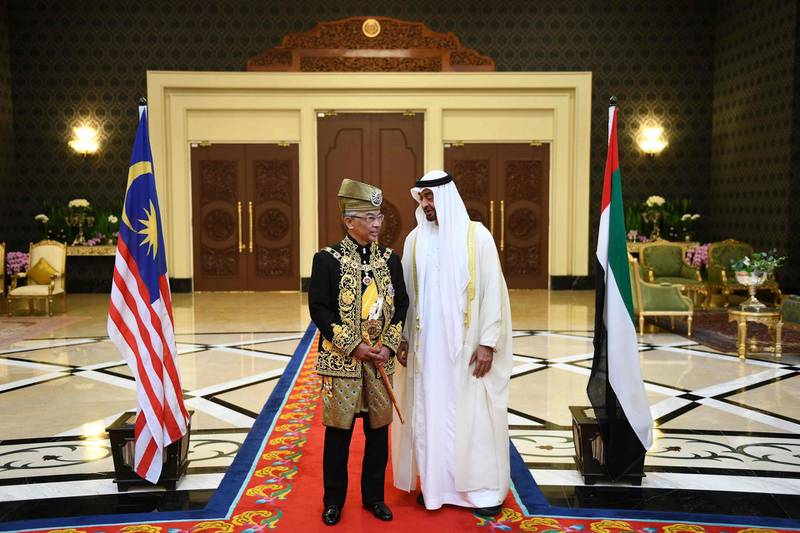 Malaysia's King Abdullah talks to Sheikh Mohamed bin Zayed. AFP