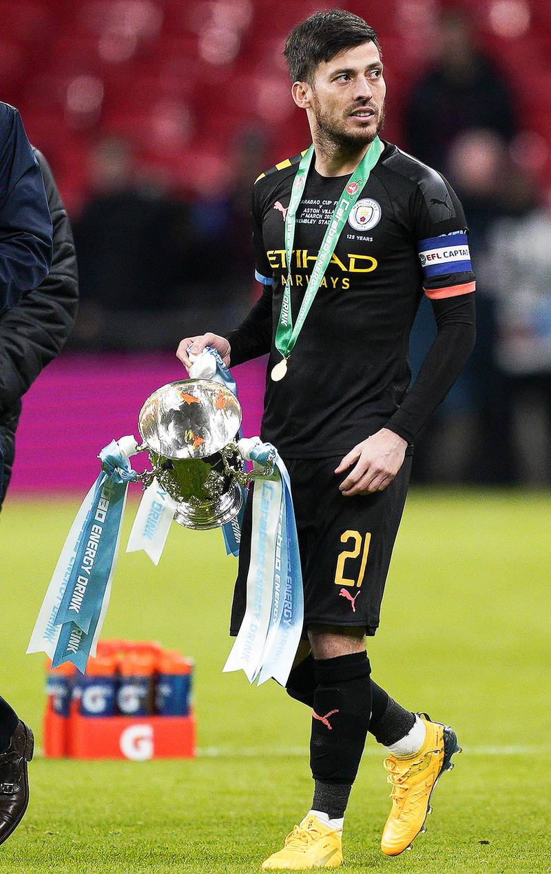 epa08263022 David Silva of Manchester City walks with the trophy after the Carabao Cup final between Aston Villa and Manchester City at Wembley in London, Britain, 01 March 2020.  EPA/WILL OLIVER EDITORIAL USE ONLY. No use with unauthorized audio, video, data, fixture lists, club/league logos or 'live' services. Online in-match use limited to 120 images, no video emulation. No use in betting, games or single club/league/player publications