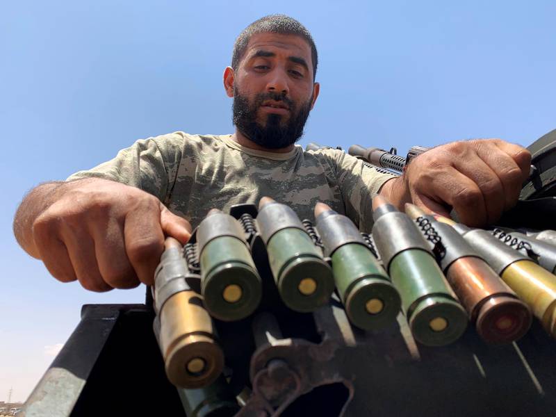 A member of the troops loyal to Libya's internationally recognised government prepares before heading to Sirte, on the outskirts of Misrata, Libya. Reuters