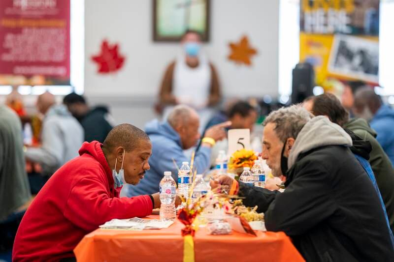 Members of the public eat Thanksgiving dinner last year at the Central Union Mission in Washington. EPA