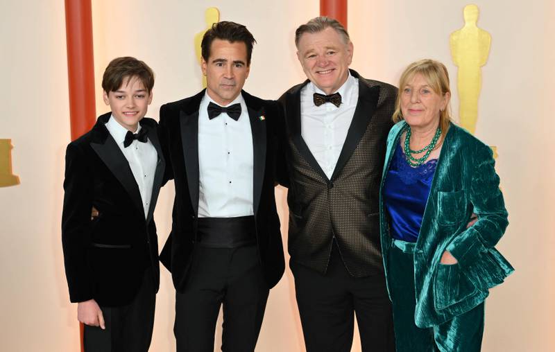 Colin Farrell and his son Henry Tadeusz Farrell, with Brendan Gleeson and his wife Mary. AFP