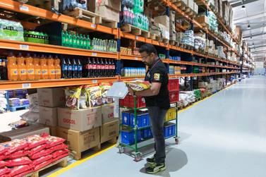 A worker fulfills a customer's order at a warehouse of Bigbasket, an e-grocer operated by Supermarket Grocery Supplies, in Bengaluru, India. Bangalore-based Bigbasket is a sign of the changing times: it delivers everyday cooking essentials like ghee, diced coconut and fragrant basmati rice, as well as 18,000 other items from bread to laundry detergent to eight million customers in 25 Indian cities. Bloomberg