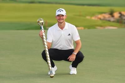 Nicolai Hojgaard of Denmark with the DP World Tour Championship trophy after his victory. Getty Images