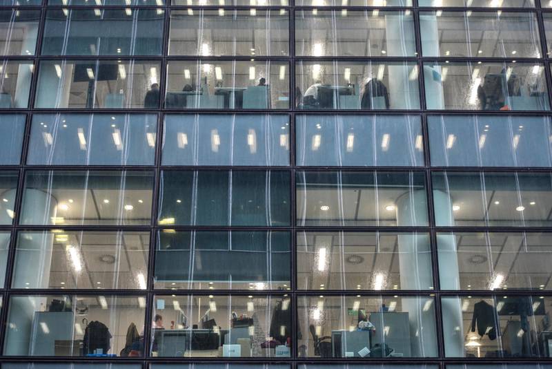 LONDON, ENGLAND - MARCH 05: Workers are seen at their desks inside the HSBC tower at Canary Wharf on March 5, 2020 in London, England. HSBC cleared the research department earlier today, Thurs, after a worker tested positive for Covid-19. There are 90 confirmed cases of coronavirus in the UK. (Photo by Peter Summers/Getty Images)