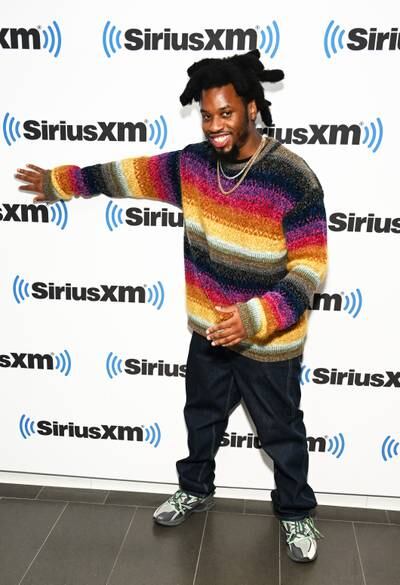 Rapper and singer Denzel Curry opts for a bold, bright sweater to visit SiriusXM Studios in New York. Getty Images