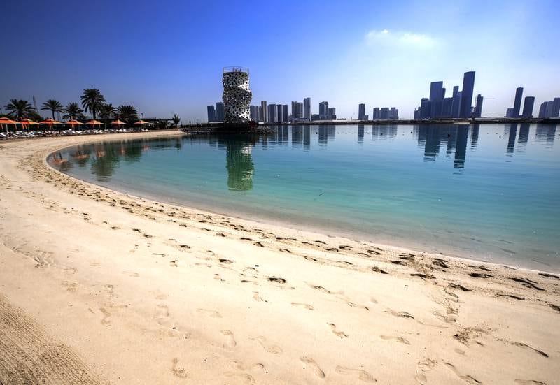 The Club Abu Dhabi's main beach now surrounded by the new Abu Dhabi skyline. Victor Besa / The National