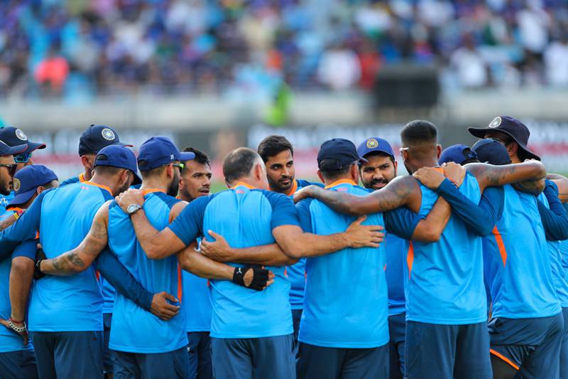 India team members huddle before the start. AFP