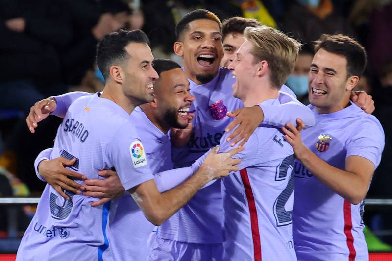 Barcelona players celebrate their first goal scored by Dutch midfielder Frenkie De Jong. AFP