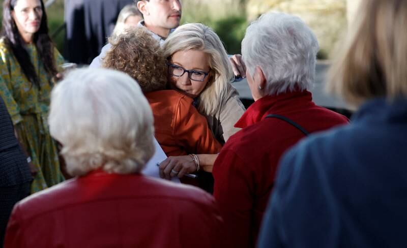 Ms Cheney hugs a supporter. Reuters