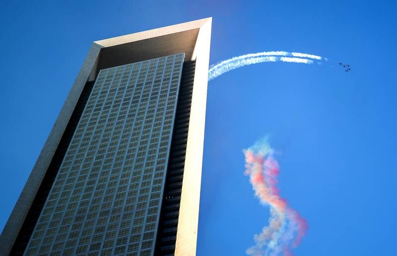Al Fursan aerobatic team puts on a display near the Adnoc Events Village in Abu Dhabi. Victor Besa / The National