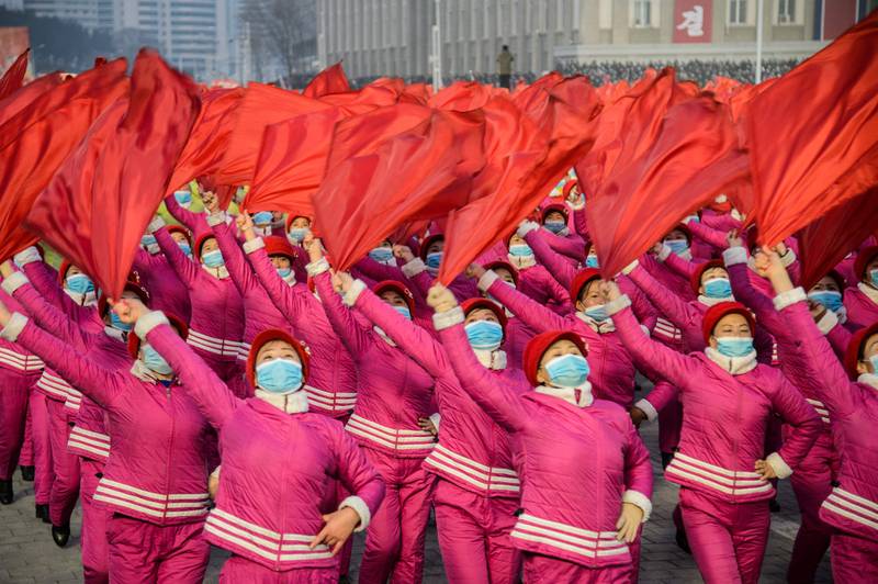 Women march after the Pyongyang City rally to carry out the decisions of the 4th Plenary Meeting of the 8th Central Committee of the Workers' Party of Korea, at Kim Il Sung Square in Pyongyang, North Korea. AFP
