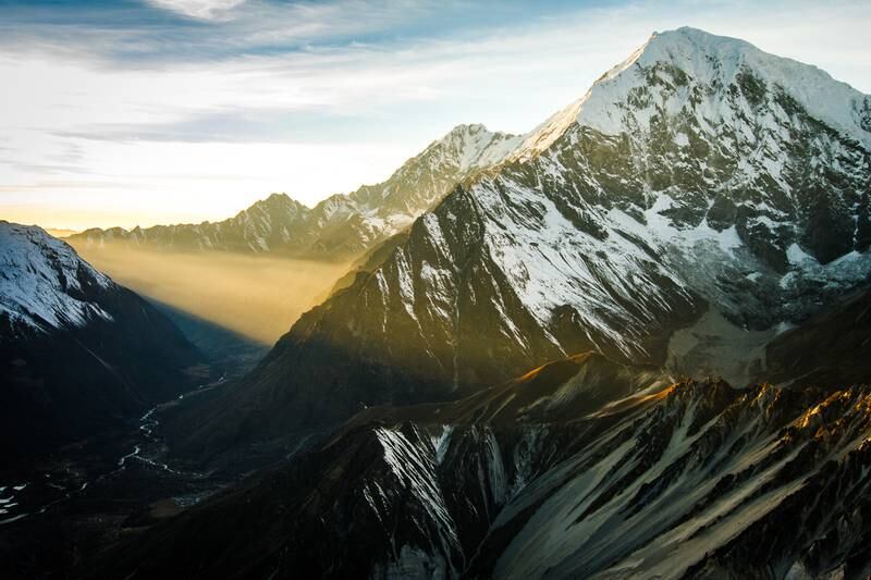 A shaft of dawn light illuminates Nepal’s Langtang valley 