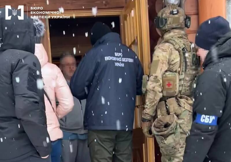 A handout photo made available by the Economy Security Bureau of Ukraine shows detectives entering the house of Ukrainian business tycoon Ihor Kolomoisky (3L) in Dnipro, Ukraine, 01 February 2023. EPA / Economy of Security Bureau of Ukraine