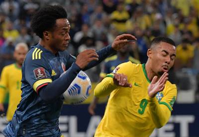 Colombia's Juan Cuadrado and Brazil's Gabriel Jesus vie for the ball. AFP