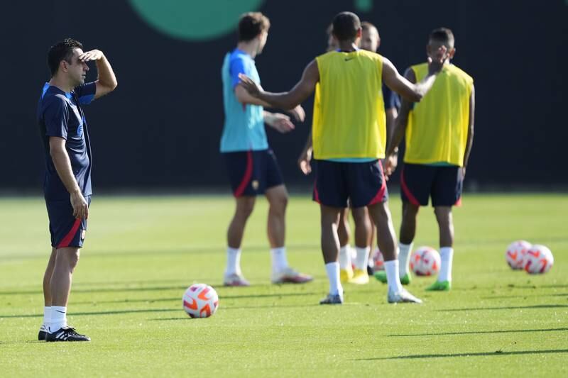 Barca manager Xavi Hernandez oversees training session. EPA