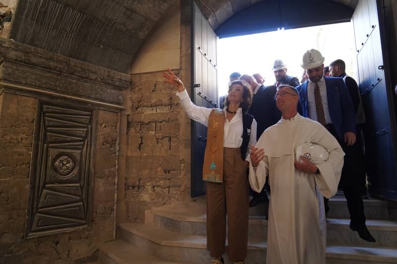 Ms Azoulay and Father Poquillon tour the church. Ismael Adnan for The National