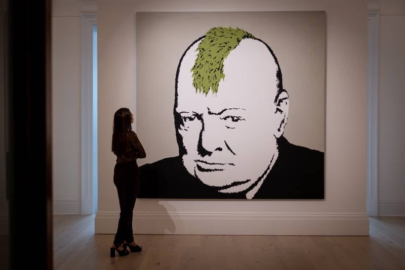 The 2003 artwork titled 'Turf War' by British artist Banksy is also on display at Sotheby's. EPA