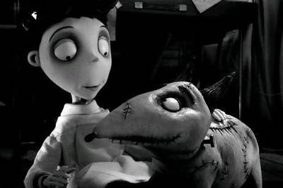 Victor Frankenstein, voiced by Charlie Tahan, with his dog, Sparky, in a scene from Frankenweenie. AP