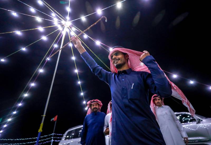 Abu Dhabi, United Arab Emirates, December 10, 2019.    -- Ali Qahtani celebrates the victory of a two year old camel at the Al Dhafra Festival in Abu Dhabi, UAE.Victor Besa/The NationalSection:  NAReporter:  Anna Zacharias