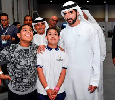 Sheikh Hamdan and Sheikh Saeed bin Maktoum bin Juma, President of the UAE Padel Association, pose for a photo at the Special Olympic Mena Games on Monday. Wam