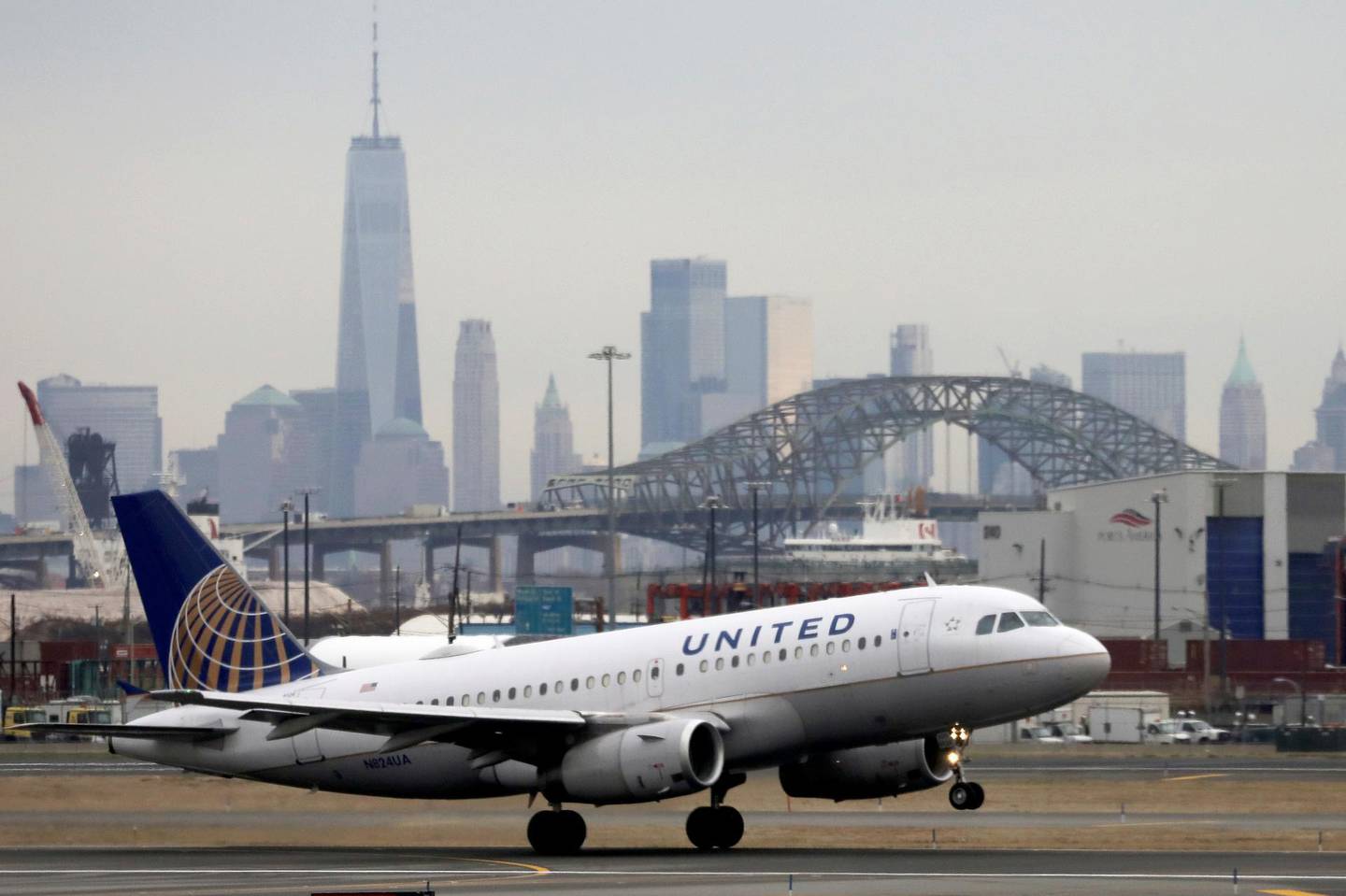 FILE PHOTO: A United Airlines passenger jet takes off with New York City as a backdrop, at Newark Liberty International Airport, New Jersey, U.S. December 6, 2019. REUTERS/Chris Helgren/File Photo  GLOBAL BUSINESS WEEK AHEAD