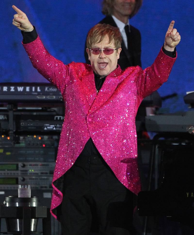Elton John, in a pink sequinned jacket, performs during Queen Elizabeth Ii's Diamond Jubilee concert at Buckingham Palace, London on June 4, 2012. Getty Images