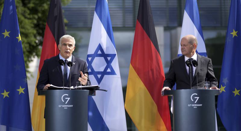 German Chancellor Olaf Scholz, right, and Israeli Prime Minister Yair Lapid address the media during a joint press conference in Berlin.  AP