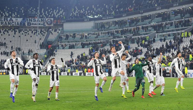 Juventus players acknowledge their fans after triumphing against Chievo. EPA