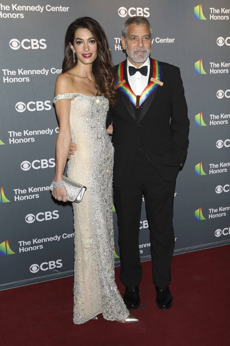 George Clooney and wife Amal Clooney, in a sequinned Valentino gown, arrive at the 45th Kennedy Centre Honours in Washington on December 4. AP 