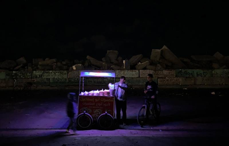 A vendor sells nuts on a cart in Gaza City. Reuters