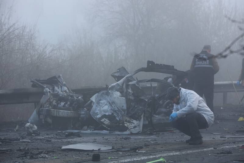 Forensic experts examine the site of the car bombing along a motorway in Diyarbakir, Turkey. All photos: Reuters