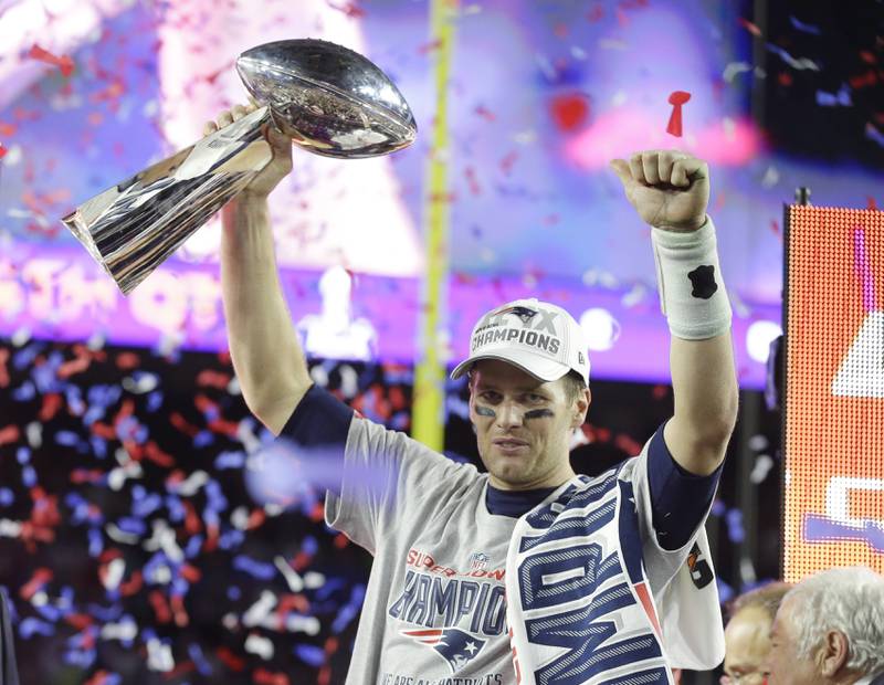New England Patriots quarterback Tom Brady celebrates with the Vince Lombardi Trophy after the NFL Super Bowl victory over the Seattle Seahawks in 2015. The Patriots won 28-24. AP