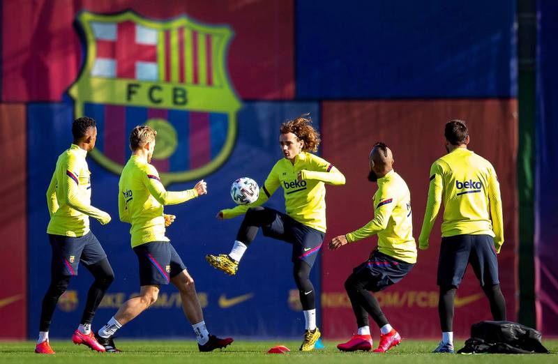 Barcelona's Antoine Griezmann, centre, during a training session on Wednesday. EPA