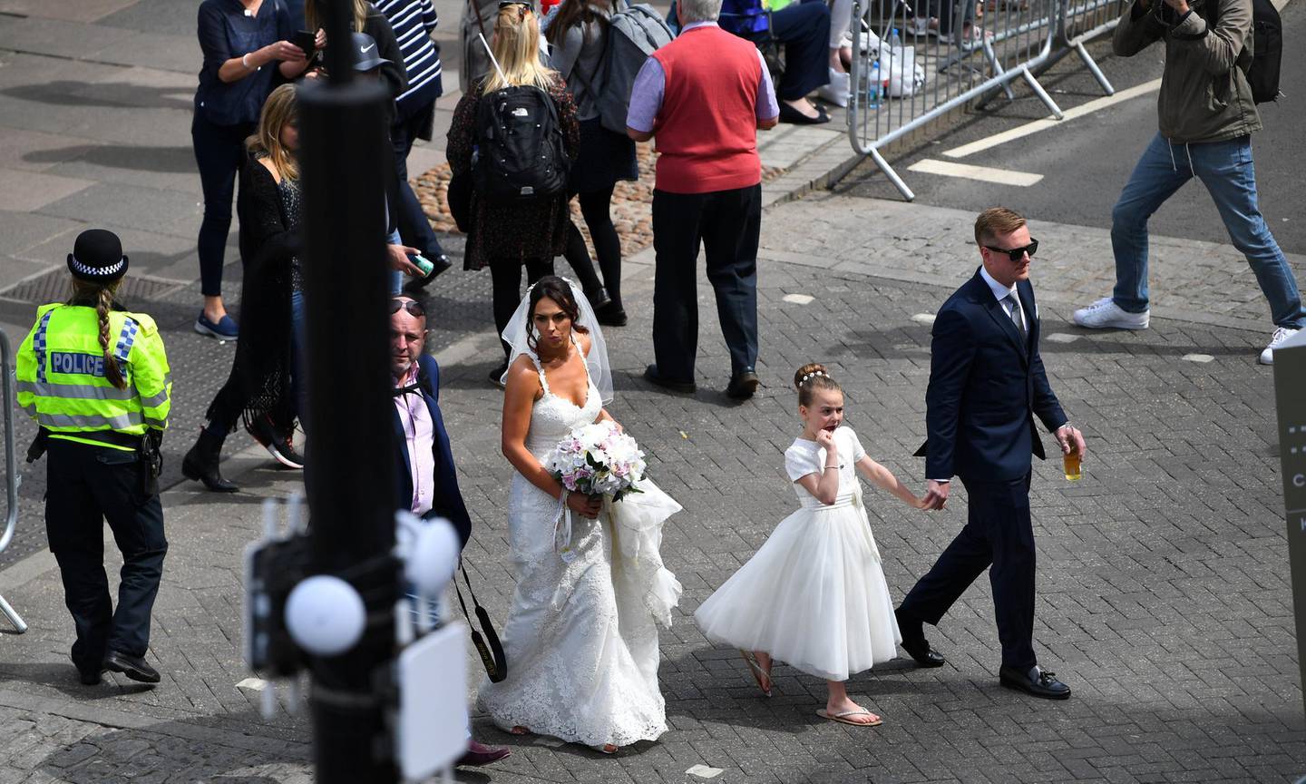Bride Vicky Hallam walks through Windsor after her marriage in the Guildhall, ahead of the wedding between Britain’s Prince Harry and Meghan Markle, in Windsor, Britain May 18, 2018. REUTERS/Dylan Martinez