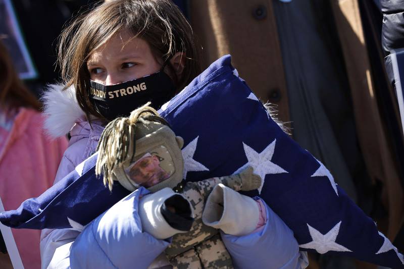 Brielle Robinson, daughter of the late Army Sgt First Class Heath Robinson outside the US Capitol in March. Getty Images / AFP
