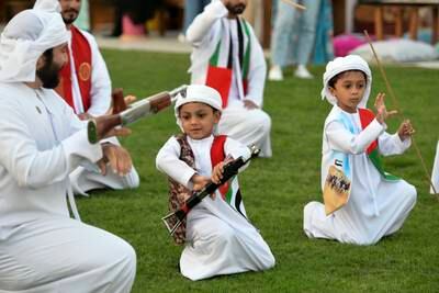 Boys are tutored in traditional Emirati music and dance by Al Mazyood Band