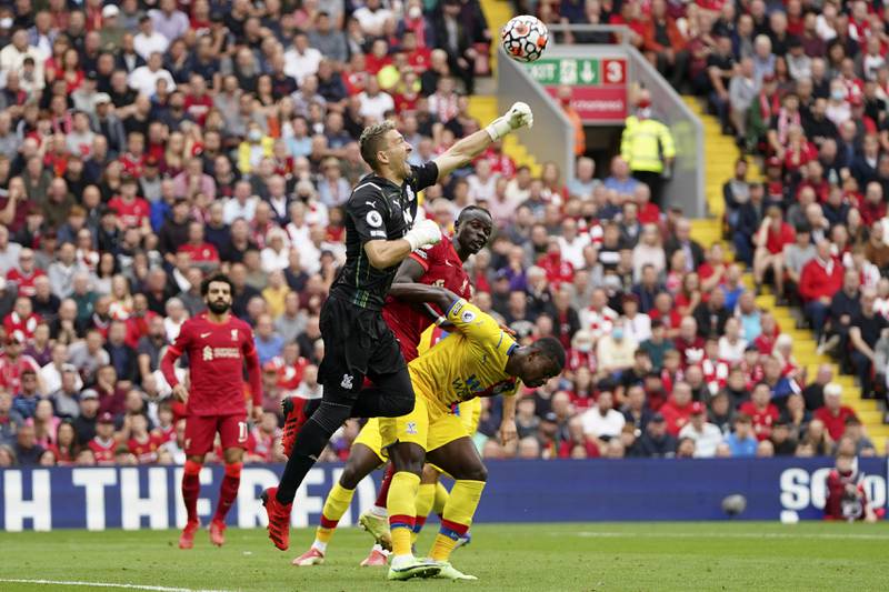 Crystal Palace goalkeeper Vicente Guaita jumps and punches the ball. AP