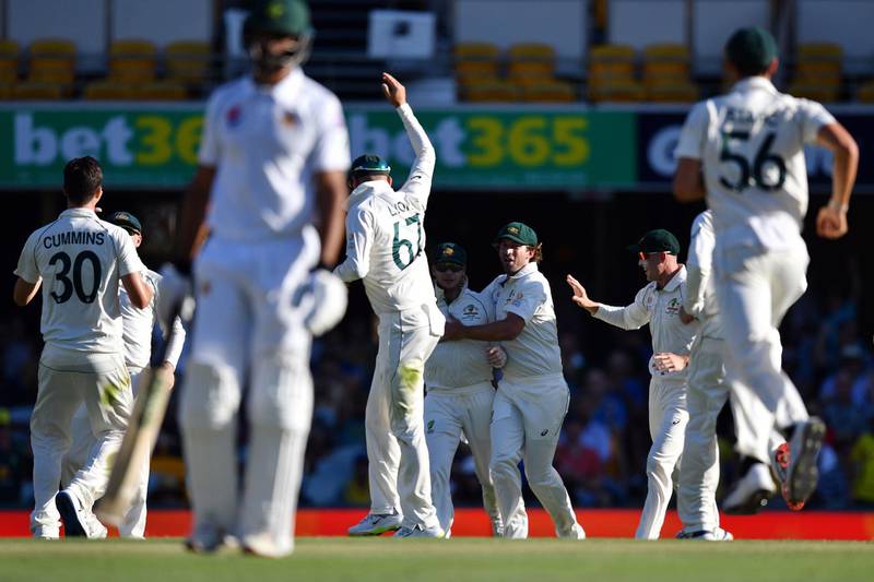 Australia's players celebrate the dismissal of Pakistan's batsman Asad Shafiq. AFP