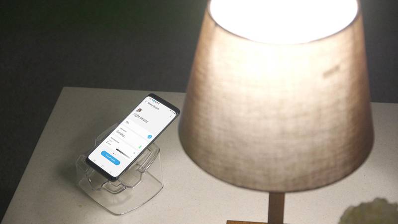 An older Galaxy smartphone is converted to a light sensor to measure the brightness level of the room. Users can easily set the device to automatically turn on the lights or the TV through SmartThings if the room becomes darker than the preset standard of light. Courtesy Samsung