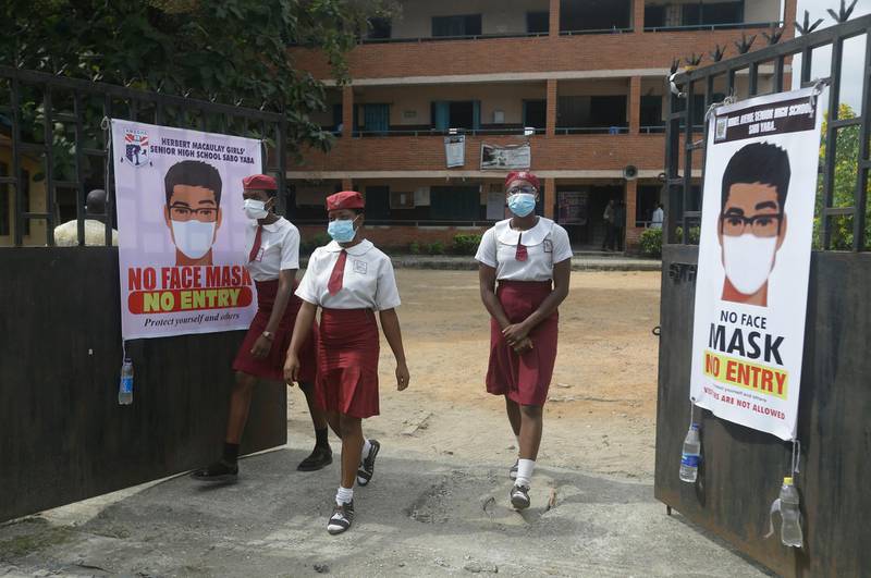 Pupils from Herbert Macaulay Girls Senior High School wear face masks to protect against coronavirus in Lagos Nigeria. Public and private schools resumed in-person classes on August 4 after months of closure. Sunday Alamba / AP