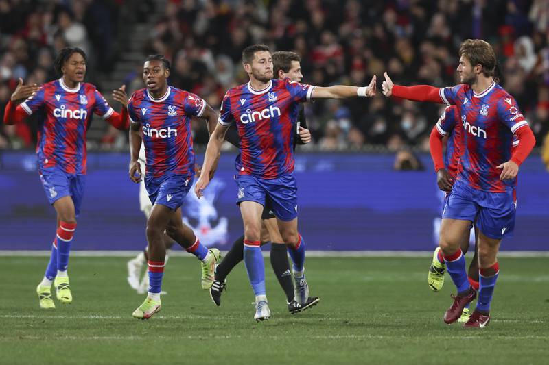 Palace defender Joel Ward, centre, is congratulated by teammates after scoring. AP