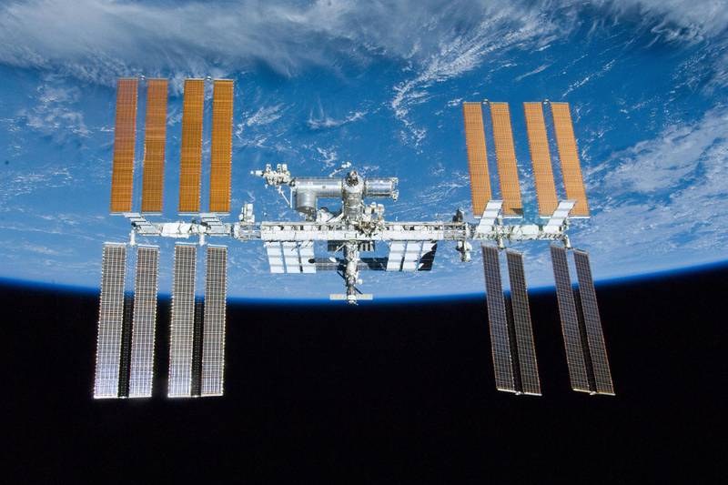 The ISS as seen from the Space Shuttle Atlantis after the station and shuttle began their post-undocking relative separation on May 23, 2010. Twenty years after the first crew arrived, the space station has hosted 241 residents and grown from three cramped and humid rooms to a complex almost as long as a football field, with six sleeping compartments, three toilets, a domed lookout and three high-tech labs. (NASA via AP)
