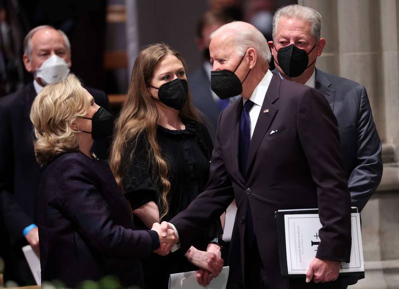 President Biden greets former US secretary of state Hillary Clinton with her daughter, Chelsea Clinton, and former US vice president Al Gore in the foreground. AFP